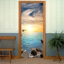 Decorative vinyl door sunset on the sea